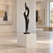 Egret White SW 7570 painted display pedestal in a 01 low gallery setting; representative room rendering.