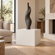 Pure White SW 7005 painted display pedestal in a 02 low living room broad setting; representative room rendering.