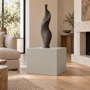 Mindful Gray SW 7016 painted display pedestal in a 02 low living room broad setting; representative room rendering.