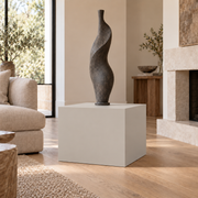 Agreeable Gray SW 7029 painted display pedestal in a 02 low living room broad setting; representative room rendering.
