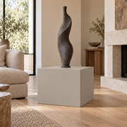Worldly Gray SW 7043 painted display pedestal in a 02 low living room broad setting; representative room rendering.