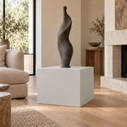 On the Rocks SW 7671 painted display pedestal in a 02 low living room broad setting; representative room rendering.