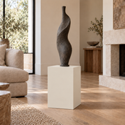 Shoji White SW 7042 painted display pedestal in a 02 low living room narrow setting; representative room rendering.