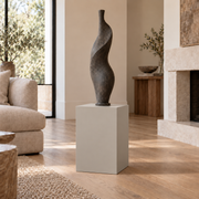 Worldly Gray SW 7043 painted display pedestal in a 02 low living room narrow setting; representative room rendering.