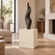Antique White SW 6119 painted display pedestal in a 02 low living room setting; representative room rendering.