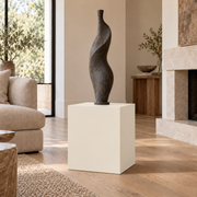 Ivory Lace SW 7013 painted display pedestal in a 02 low living room setting; representative room rendering.