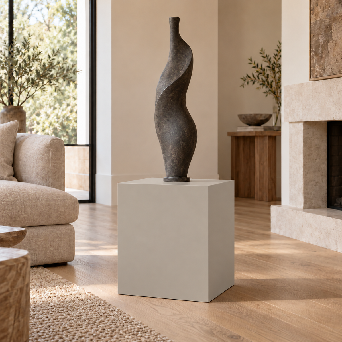 Worldly Gray SW 7043 painted display pedestal in a 02 low living room setting; representative room rendering.
