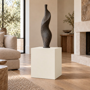 Greek Villa SW 7551 painted display pedestal in a 02 low living room setting; representative room rendering.