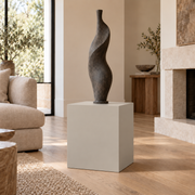 City Loft SW 7631 painted display pedestal in a 02 low living room setting; representative room rendering.