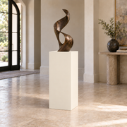 Creamy SW 7012 painted display pedestal in a 03 mid foyer narrow setting; representative room rendering.