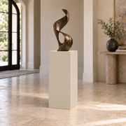Accessible Beige SW 7036 painted display pedestal in a 03 mid foyer narrow setting; representative room rendering.
