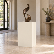 Creamy SW 7012 painted display pedestal in a 03 mid foyer setting; representative room rendering.