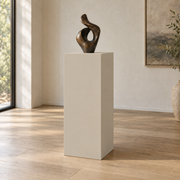 Accessible Beige SW 7036 painted display pedestal in a 04 tall gallery nook setting; representative room rendering.