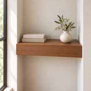 Clear Alder floating shelf in Rubio Monocoat Walnut, Wall to Wall mount; unlit representative compact-proportion room rendering, not dimension-specific.