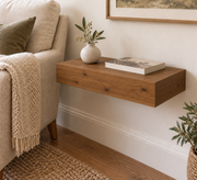 Knotty Alder floating shelf in Rubio Monocoat Dark Oak, Standard mount; unlit representative compact-proportion room rendering, not dimension-specific.