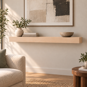Maple floating shelf in Unfinished / Stain Ready, Standard mount; unlit representative medium-proportion room rendering, not dimension-specific.