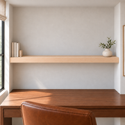 Maple floating shelf in Unfinished / Stain Ready, Wall to Wall mount; unlit representative long-proportion room rendering, not dimension-specific.